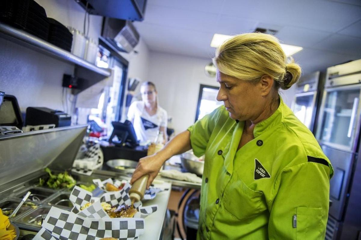 Chef Dana Longinotti, 53, of Ceres, prepares an order at the Tri-Tipery, an eatery in Ballico, Calif., on Tuesday, Sept. 26, 2017.