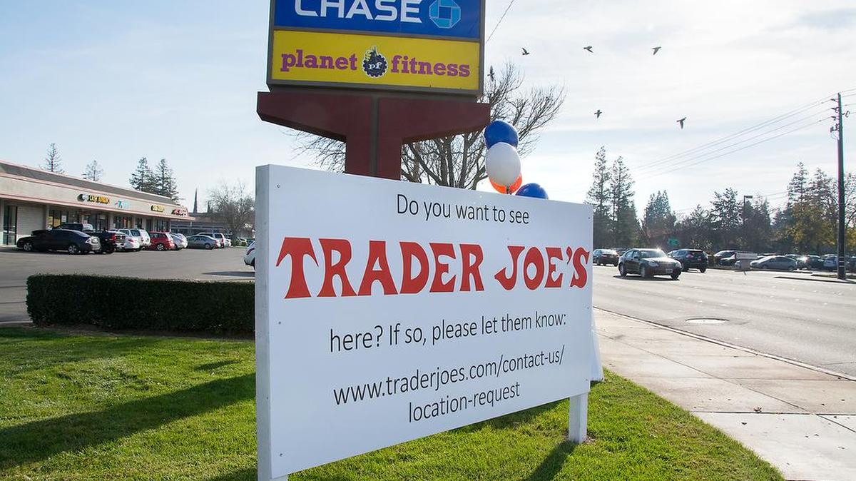 Signs asking the public to contact Trader Joe’s are posted along the corners of Century Center on Oakdale Road in Modesto, Calif. Jan. 3, 2018.