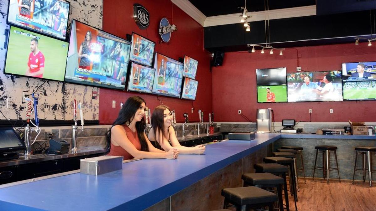 The new 29 Degrees Sports Bar & Grill in downtown Modesto, Calif. is pictured Tuesday (08-22-17). The new bar and restaurant at 917 J St. will have a 120 capacity and 40-big screen TVs inside. Floor manager Kaila Marinus (left) and bar manager Ginnel Albanez inside the eatery’s large bar area.