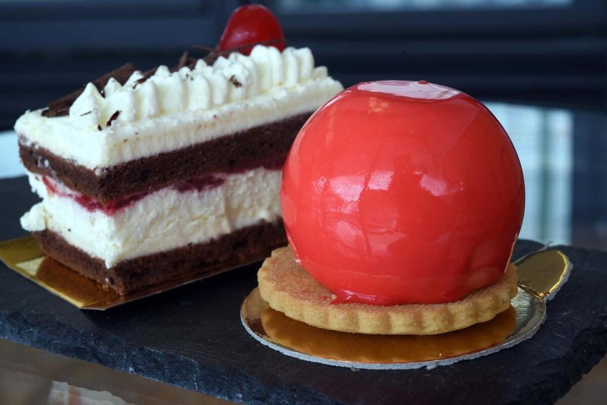 Lemon raspberry cheesecake (right) and black forest cake are pictured on Tuesday morning March 26, 2019 at the business Dessert European Bakery on McHenry Avenue in Modesto, Calif.