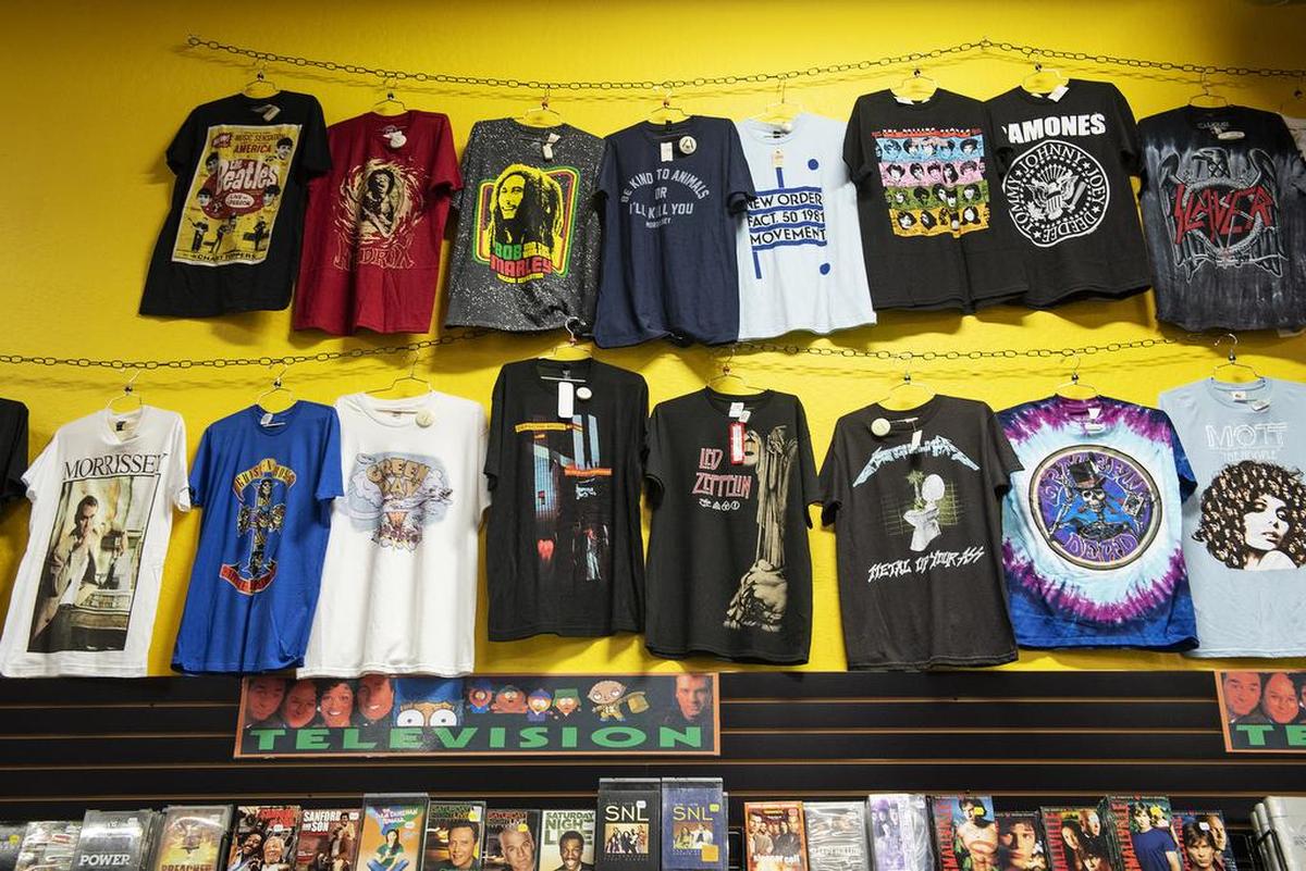 Music t-shirts at Rasputin Music in Modesto, Calif., Tuesday, Feb. 26, 2019.