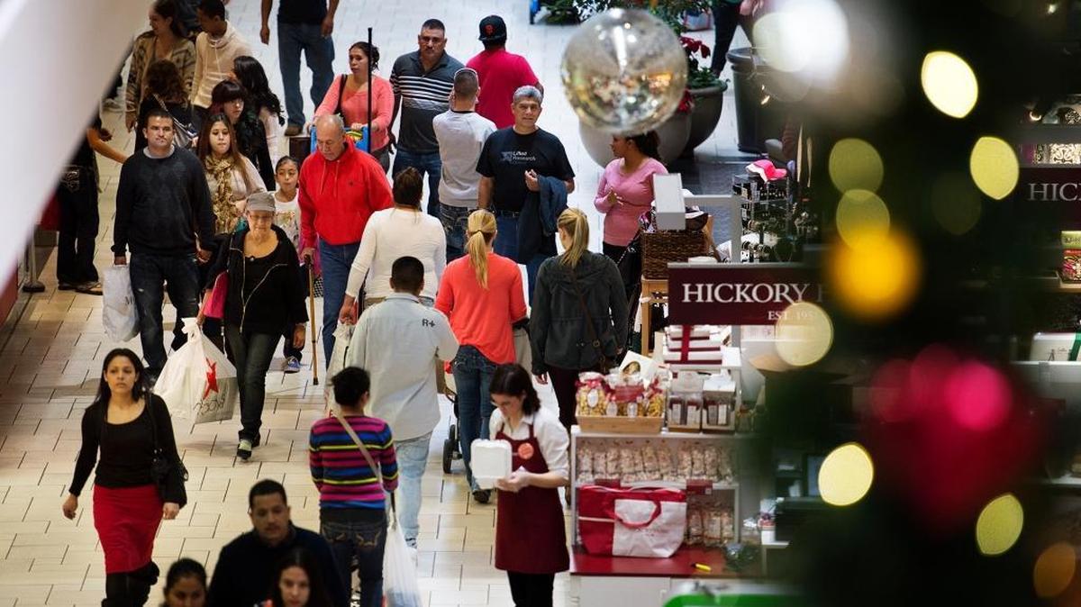 Shoppers flood the Vintage Faire Mall for steep markdowns during Black Friday shopping in Modesto in 2013.