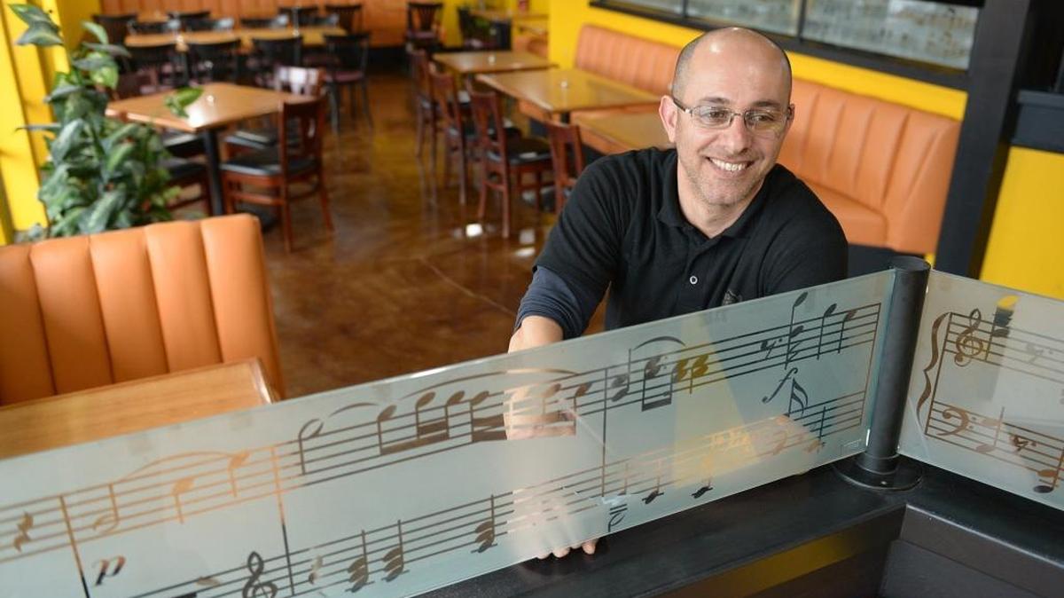 Sargon Shamoon is seen Thursday afternoon, Dec. 3, 2015, at Kraving Kebab Pizza, which he co-owns, at its new location in Turlock’s Scandia Village on South Golden State Boulevard.