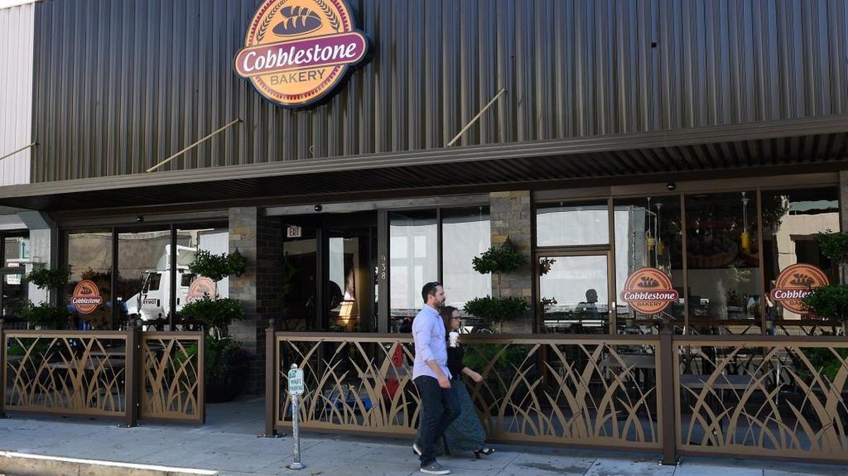 People pass Cobblestone Bakery on 11th Street Tuesday (06-27-17) in downtown Modesto, Calif. The bakery is expected to open on July 11th.