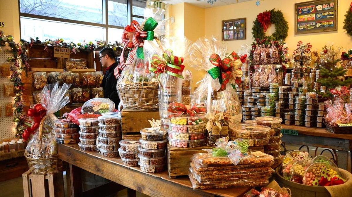 Lots of local shops and businesses are still open for last-minute shoppers on Christmas Eve Day. A shopper checks out Rodin Ranch Farmers Market in downtown Modesto, which will be open for last-minute shoppers as will the Rodin Farms Fruit Stand on Oakdale Road.