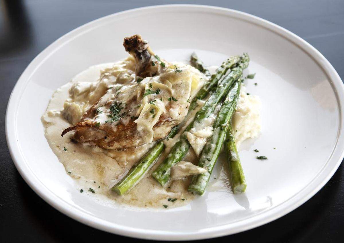 Fire roasted chicken entree, with massed potatoes and asparagus, at Wildfire Public House in Modesto, Calif., Friday, June 21, 2019.