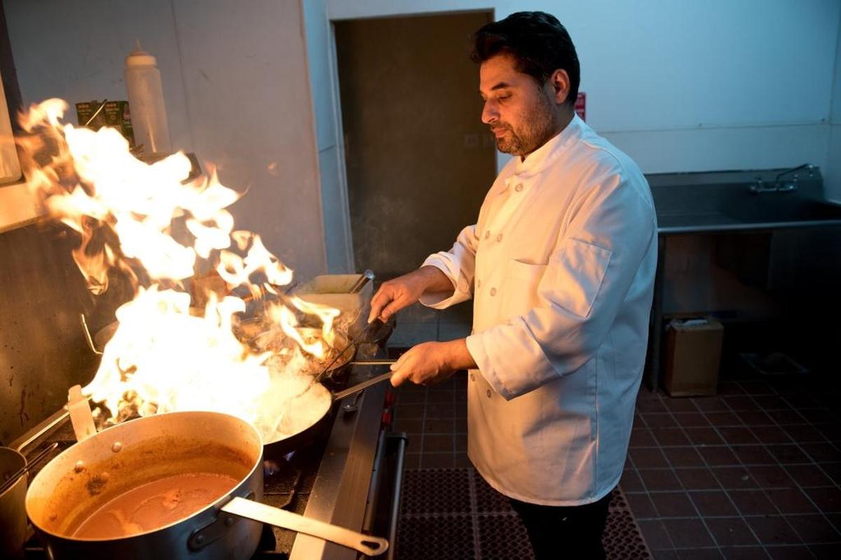 Owner and chef Gurinder Khaira works in the kitchen at Monsoon Restaurant on 10th Street in Modesto, Calif., on Thursday, March 4, 2018.