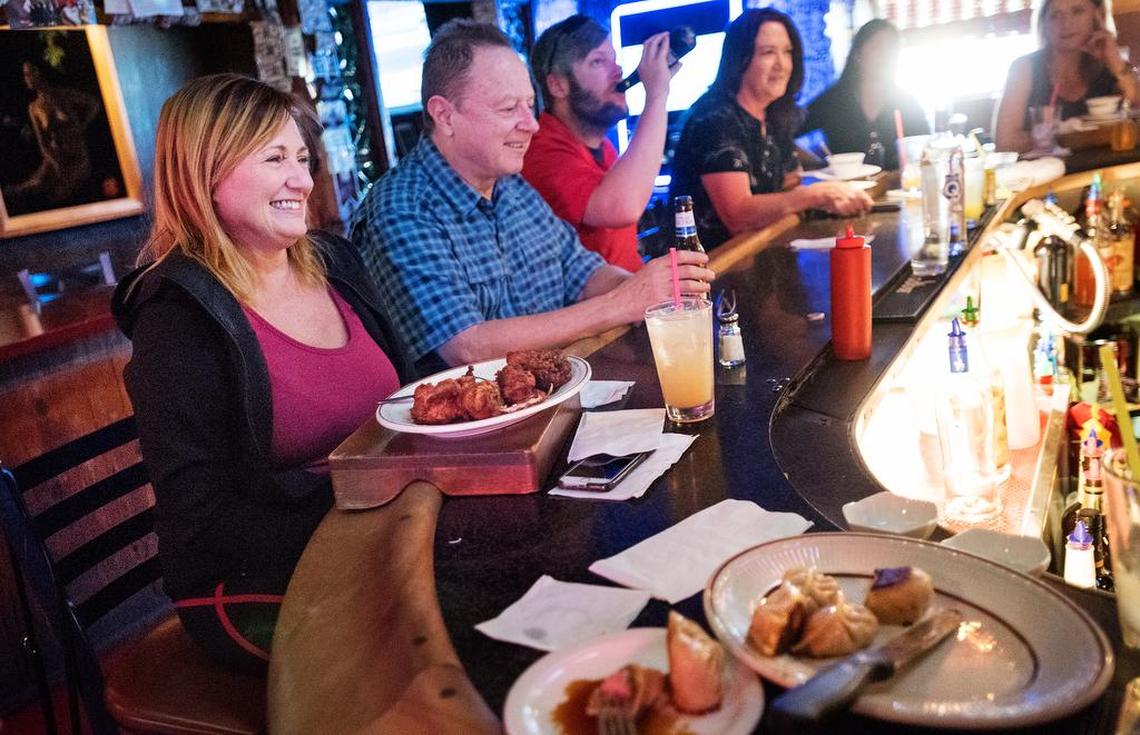 Johnna Hill, left, enjoys lunch with other patrons at Minnie’s Bar and Restaurant in Modesto, Calif., on Friday, Oct. 12, 2018.