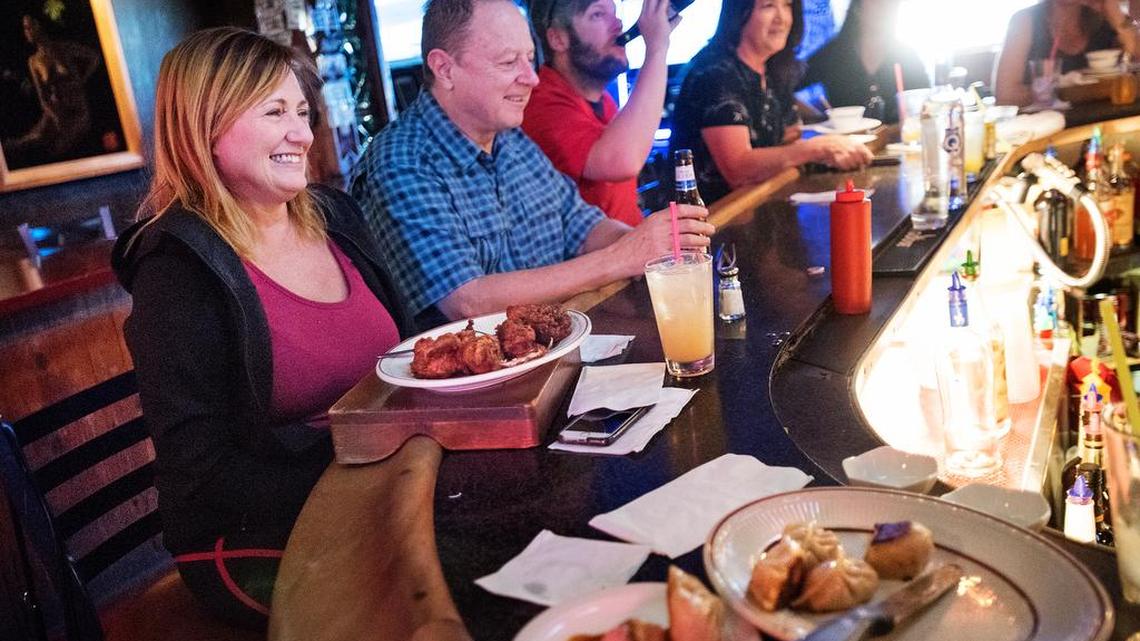 Johnna Hill, left, enjoys lunch with other patrons at Minnie’s Bar and Restaurant in Modesto, Calif., on Friday, Oct. 12, 2018.
