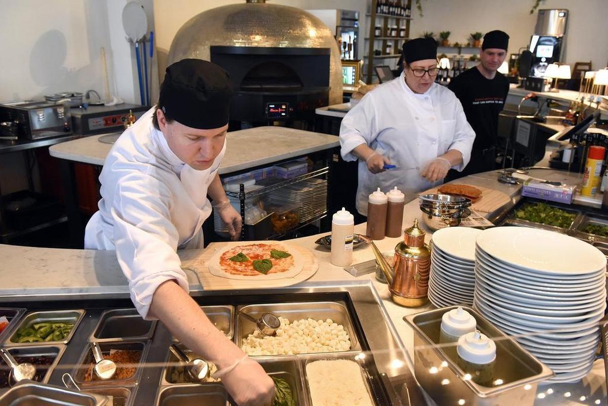 John Walling makes a Margherita pizza on Wednesday afternoon January 9, 2019 at the new business Midici The Neapolitan Pizza Company at Vintage Faire Mall in Modesto, Calif.