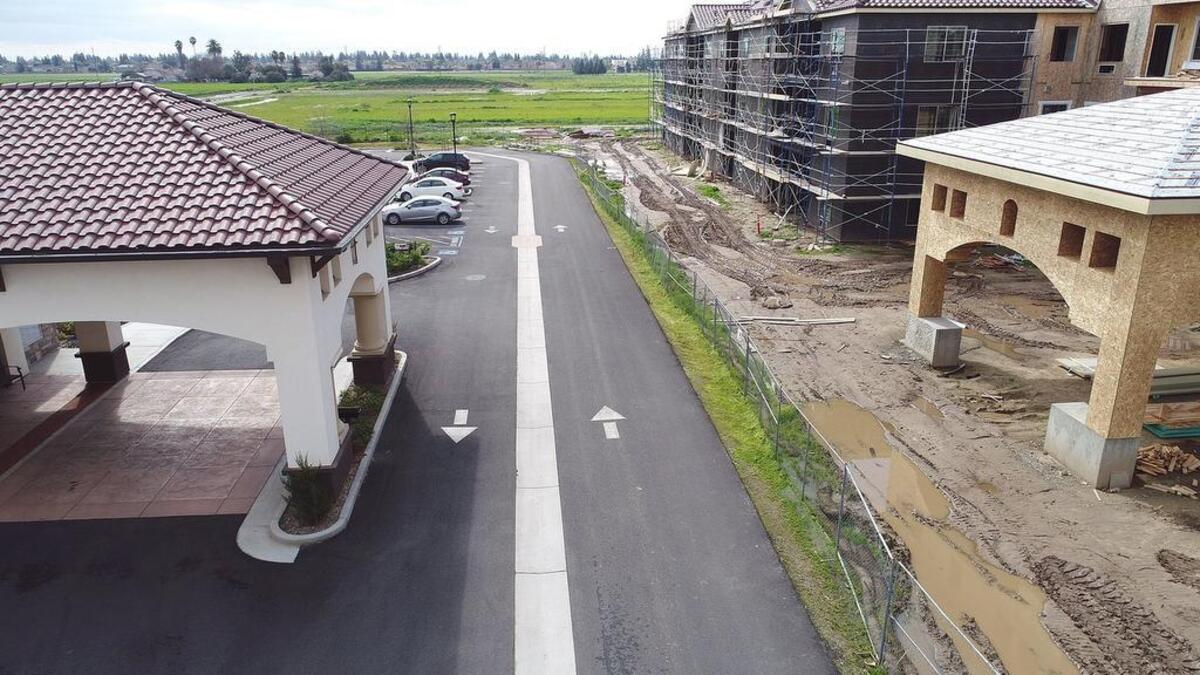 The Park (right) is under construction next to the newly completed El Rio Memory Care on Healthcare way in Modesto, Calif. on Thursday February 28, 2019.
