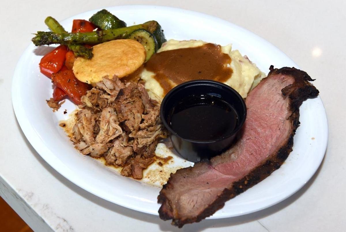 The new Buckhorn BBQ is opening at Vintage Faire Mall in Modesto, Calif. A Two Meat Platter with pulled pork and tri tip is pictured on Thursday June 7, 2018.