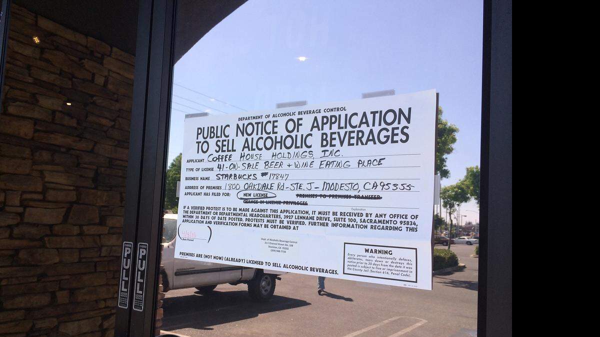 
A notice on the door of the Starbucks at the corner of Merle and Floyd avenues in Modesto on Friday indicates the shop has applied for a license to sell beer and wine.
