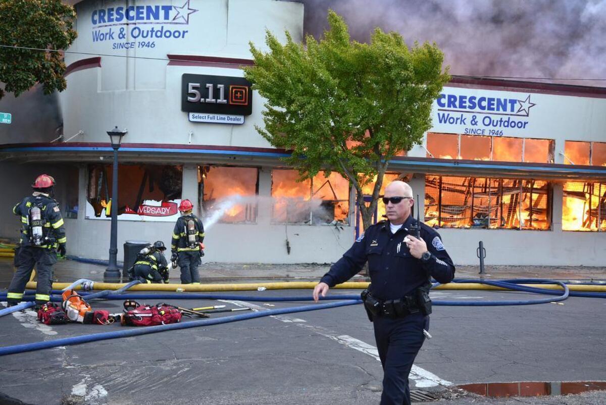 Modesto Fire Department along with multiple other fire departments and Modesto Police responded to a four-alarm fire at the corner of I Street and 8th, at Crescent Work & Outdoor (also known as Crescent Supply) in downtown Modesto, Calif., Friday September 14, 2018.