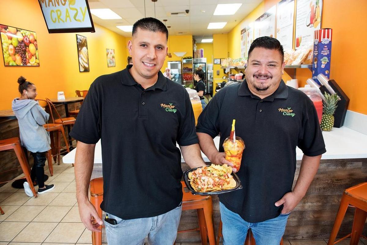 Owners Andy Lopez, left, and Larry Rivera, right, are expanding their Mango Crazy business. Photographed August 23, 2018.