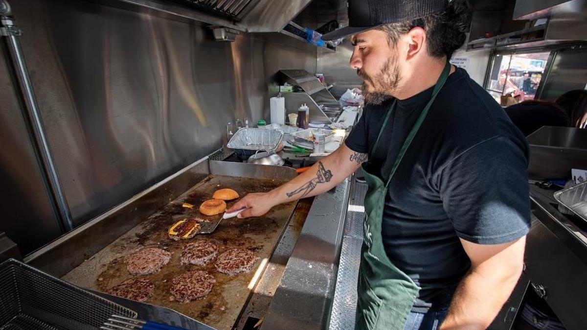 Chef Freddie Nuno cooks for the lunch crowd as the Tri-Tipery launched their new food truck in Merced County on Thursday in Hilmar, Calif., April 26, 2018.