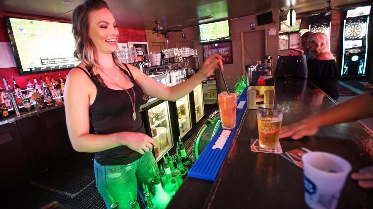 Bartender Lauren Wendel prepares a drink at Nino’s Place on McHenry Avenue in Modesto, Calif., Tuesday, August 21, 2018.