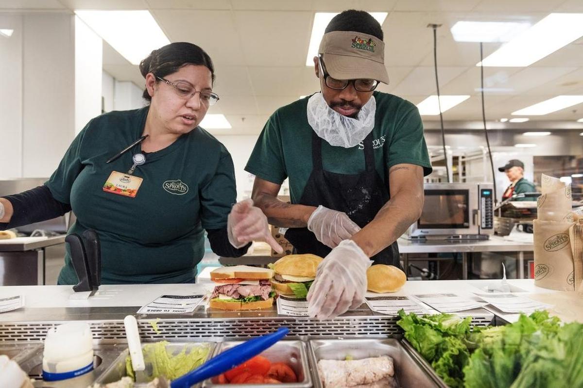 Lauren Valdez, left, and Jay Macklin, right, make sandwiches at Sprouts Market on McHenry Avenue in Modesto, Calif., on Wednesday, March 28, 2018.