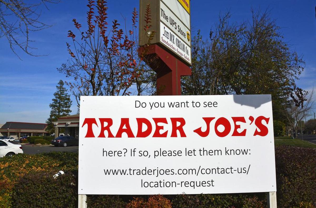 Signs asking the public to contact Trader Joe’s are posted along the corners of Century Center on Oakdale Road in Modesto, Calif. Jan. 3, 2018.