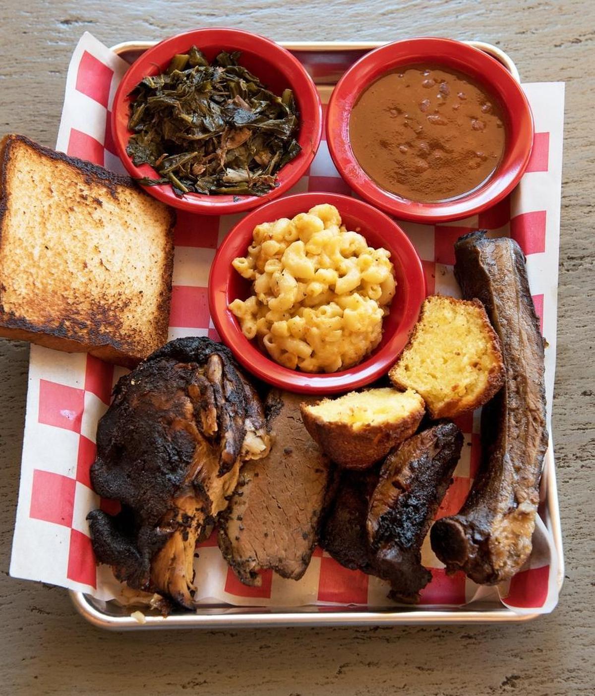 BBQ Plate, smoked chicken, pork ribs, beef ribs, smoked beef brisket with mac & cheese, collard greens, baked beans and corn bread at Fired Up Grill & Meal Prep at 1778 Mitchell Road in Ceres, Calif., Thursday, July 10, 2018.