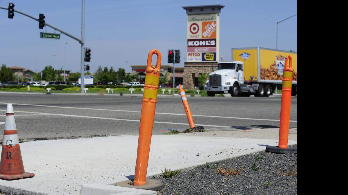 
Construction cones and newly laid sidewalk can be seen across from the Crossroads Shopping Center in Riverbank.
