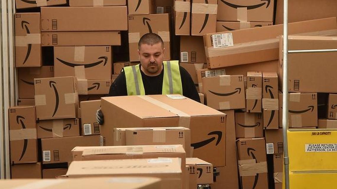 Victor Alvarez loads a trailer with outgoing packages at the Amazon Fulfillment Center in Patterson on July 7, 2016.