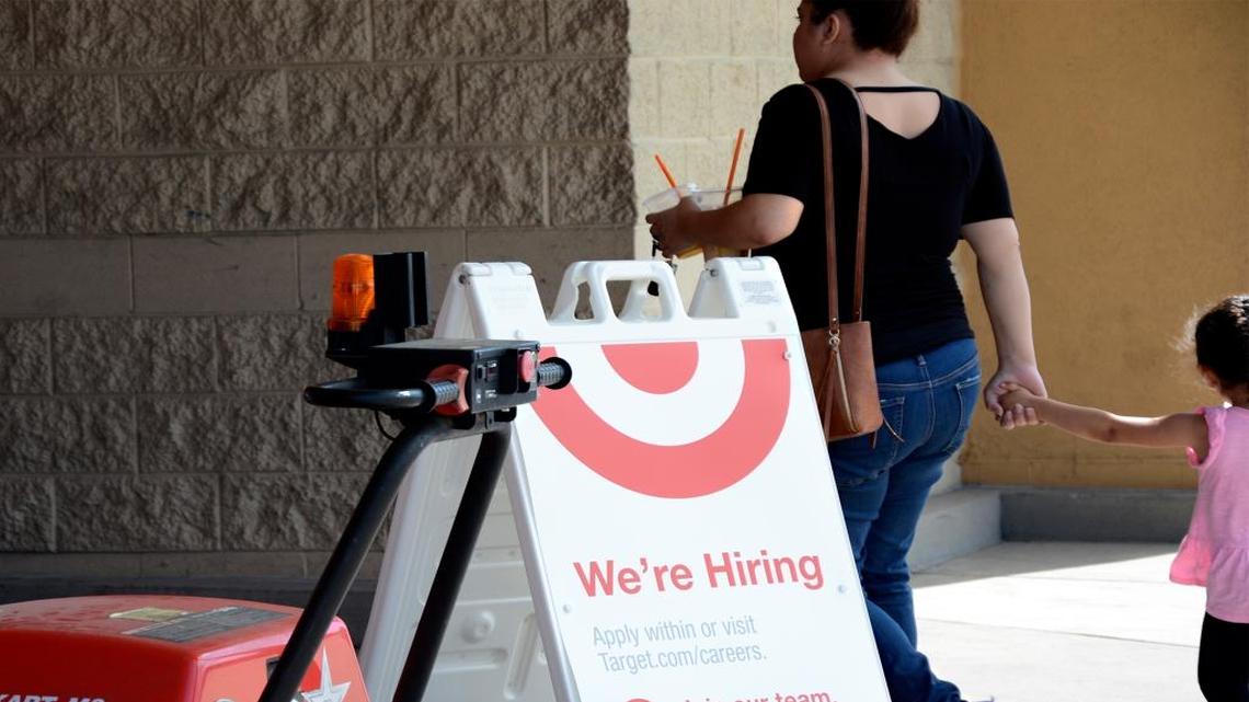 Target is among the big retail stores hiring for the holidays. All locations, including those in the Modesto area, will have an on-site holiday job fair Oct. 13-15, 2017. People walk past a “We’re hiring” sign at the Target on Sisk Road in north Modesto, Calif. Thursday (9-21-17).