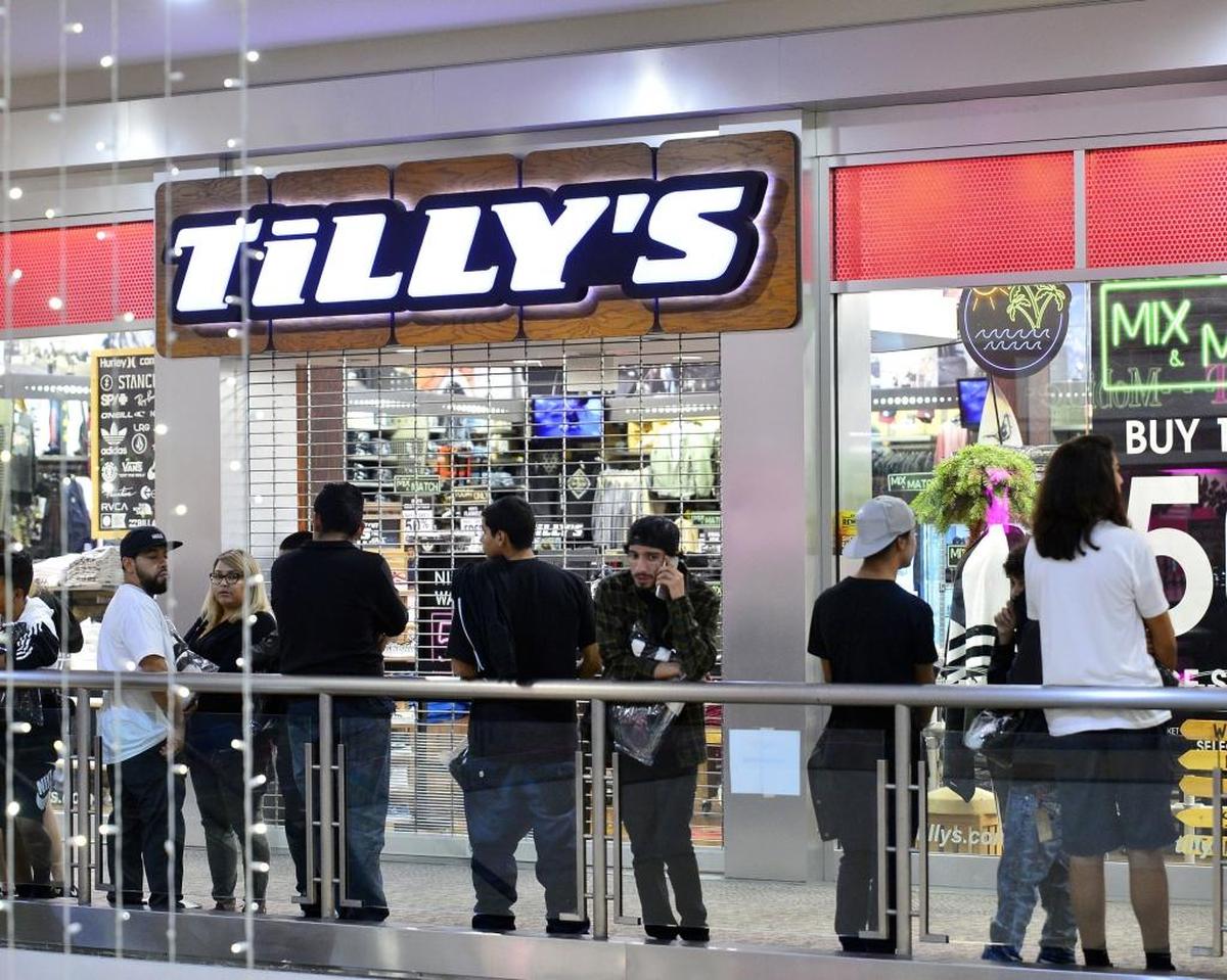 Shoppers wait for the store Tilly's to open during the Black Friday Sale on Thanksgiving Day, November 23, 2017, at the Vintage Faire Mall in Modesto California.