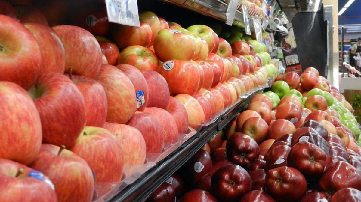 LED lights, upper right, save energy while providing attractive lighting for apples at the Save Mart store in Ripon, seen Wednesday, June 29, 2016. This is among the energy-saving measures installed by Pacific Gas & Electric Co.