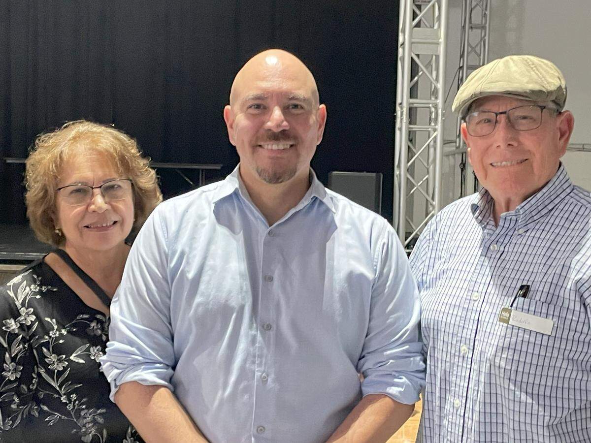 Parents Graciela and Rodolfo Serrato joined son Erick Serrato, center, when he spoke on Latino economic prospects in Modesto, Calif., on May 15, 2025.