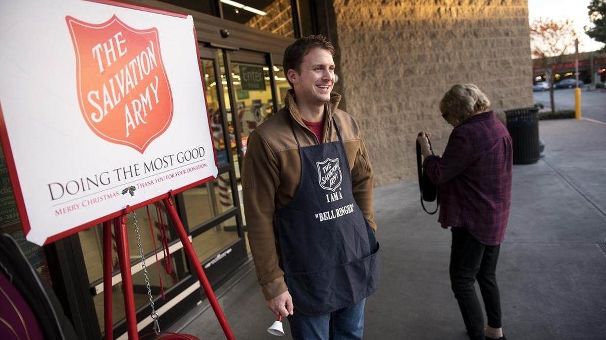 Turlock mayor Gary Soiseth rings the bell for the Salvation Army at the Walmart Neighborhood Market in Turlock, Calif., on Saturday, Dec. 12, 2015. Mayors from around the area are competing to see who can gather the most donations in a friendly kettle challenge.
