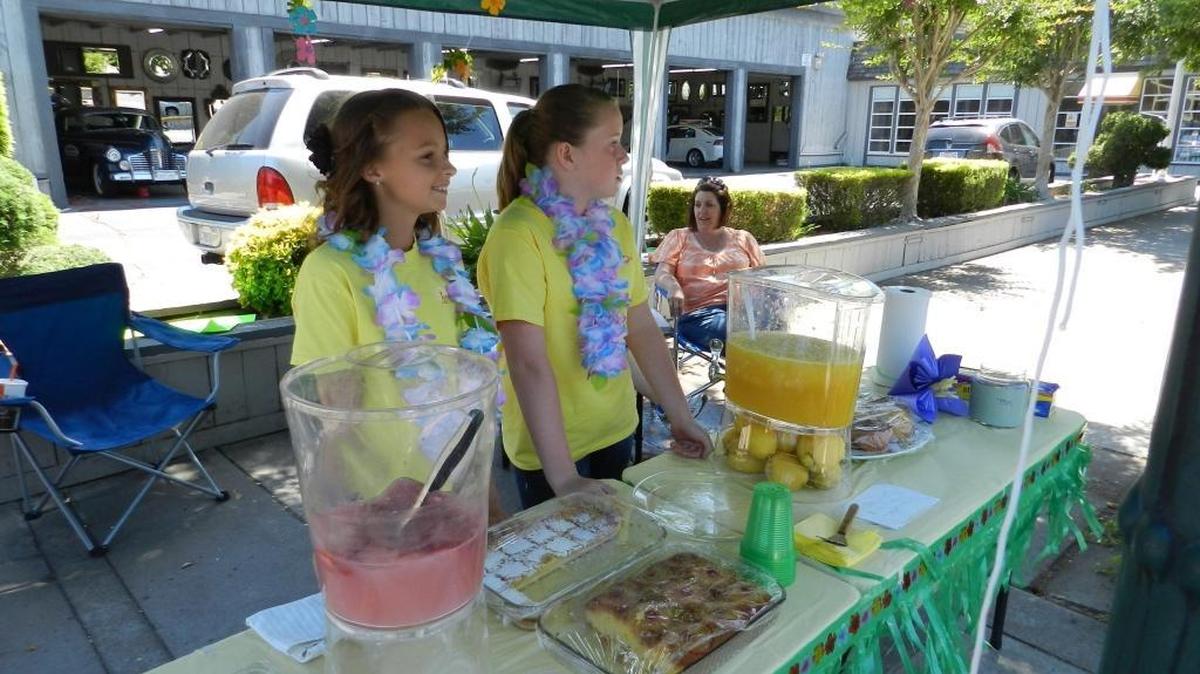 Kristyn Dexter and Madison Whisenand had their Lemonade Day stand right in front of Don’s Mobile Glass in downtown Modesto in 2013. The girls got to use the business’ old-time popcorn machine to offer free popcorn with a lemonade purchase.