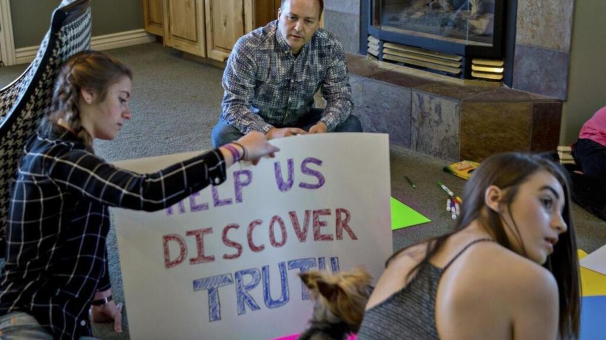At their home in East Millcreek, Utah, on April 15, Jeffrey Anderson makes protest signs with daughters Ashley, left, and Ellie for the March for Science in Washington. The event, and hundreds of satellite marches planned across the nation, are in support of scientific research, which many feel has increasingly come under attack during the Trump administration. “The wholesale disregard of truth and fact by the president and his close advisers, their devaluing evidence and the scientific method, is so extreme that I can’t be silent,” Anderson said.