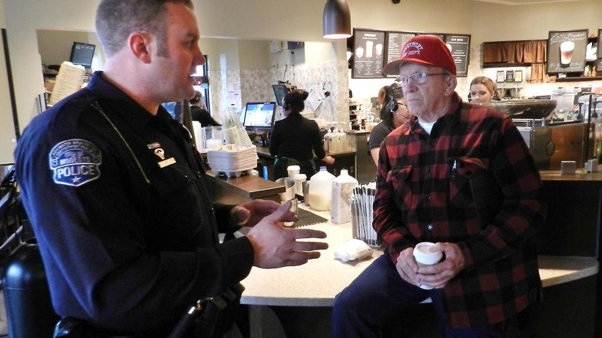 The Modesto Police Department held a Coffee With a Cop gathering at the Starbucks at East Whitmore Avenue and Crows Landing Road in Modesto in January. Officer Billy Boyle talks with county resident Gary Thompson.