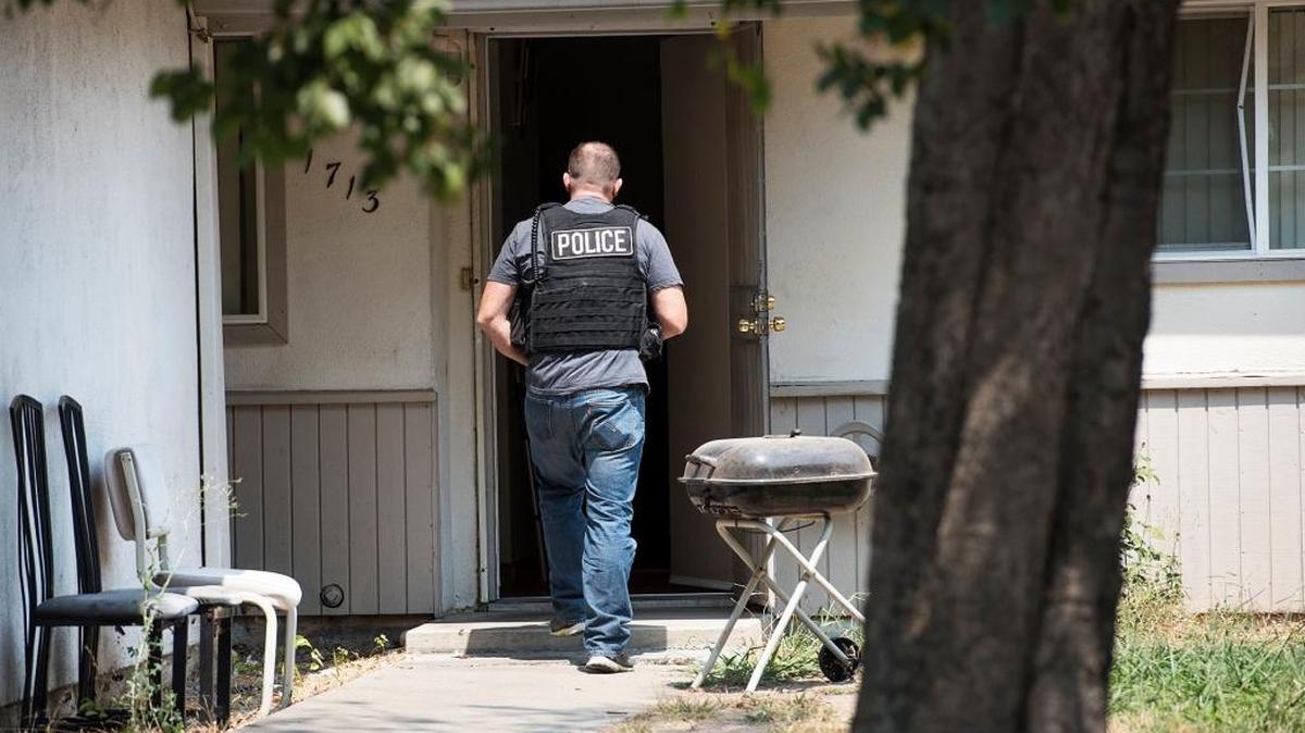 Modesto police execute a search warrant on Tulane Drive in Modesto in August. The City Council has accepted a $1.5 million federal grant to hire a dozen new officers.