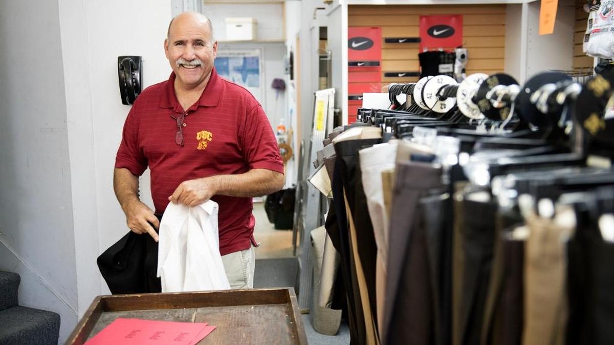 Owner Stuart Landon organizes some clothing at Landon’s mens wear store in Riverbank, Calif., on Saturday, July 29, 2017. Landon’s is closing after 70 year in business.