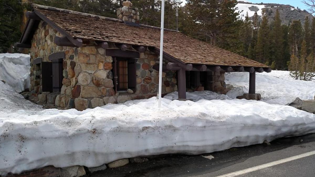 Several feet of snow surround the Tioga Pass entrance station to Yosemite on June 22, 2017.