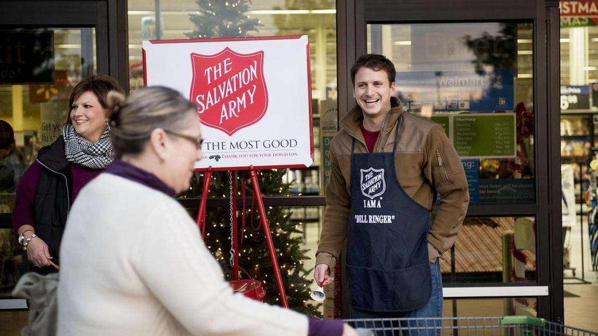 Turlock Mayor Gary Soiseth rings the bell for the Salvation Army with Kristin Bettencourt, left, at the Walmart Neighborhood Market in Turlock on Dec. 12.