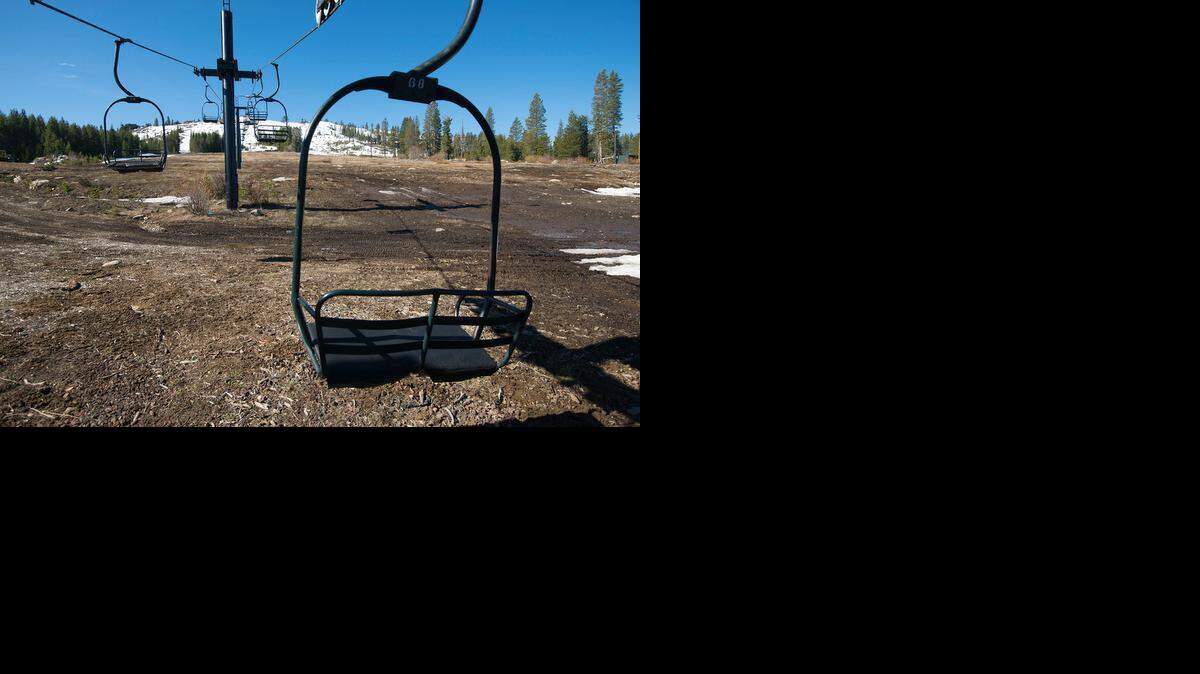 
Ski lift chairs sit idle at Soda Springs on Wednesday. Warm winter weather has sped up the closure of several Tahoe area ski resorts – including Soda Springs.

