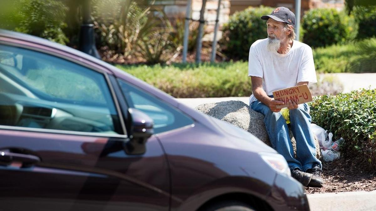 
A man panhandles at the Costco center off Pelandale Avenue in Modesto on Thursday, Sept. 10.
