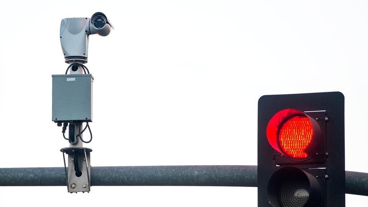 A traffic camera keeps a watchful eye at Ninth and H streets in Modesto. The Riverbank City Council is looking into recruiting people who already have cameras mounted on homes or stores to help fight crime in the city.