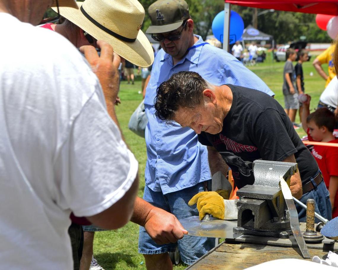 Car customizer Gene Winfield takes part in a Graffiti Summer event in Modesto, Calif., in June 2016.