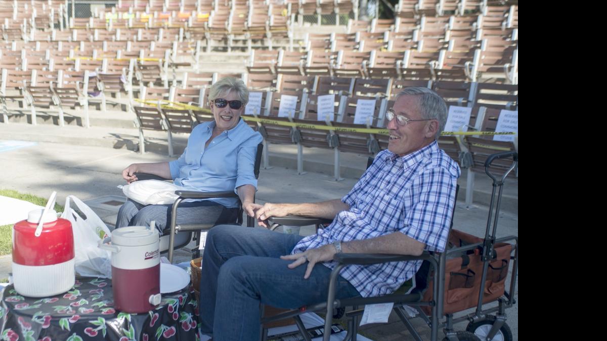 
Joyce and Rick Rowe enjoy their time in prime seating before MoBand’s Concert in the Park at Graceada Park in Modesto on Thursday.
