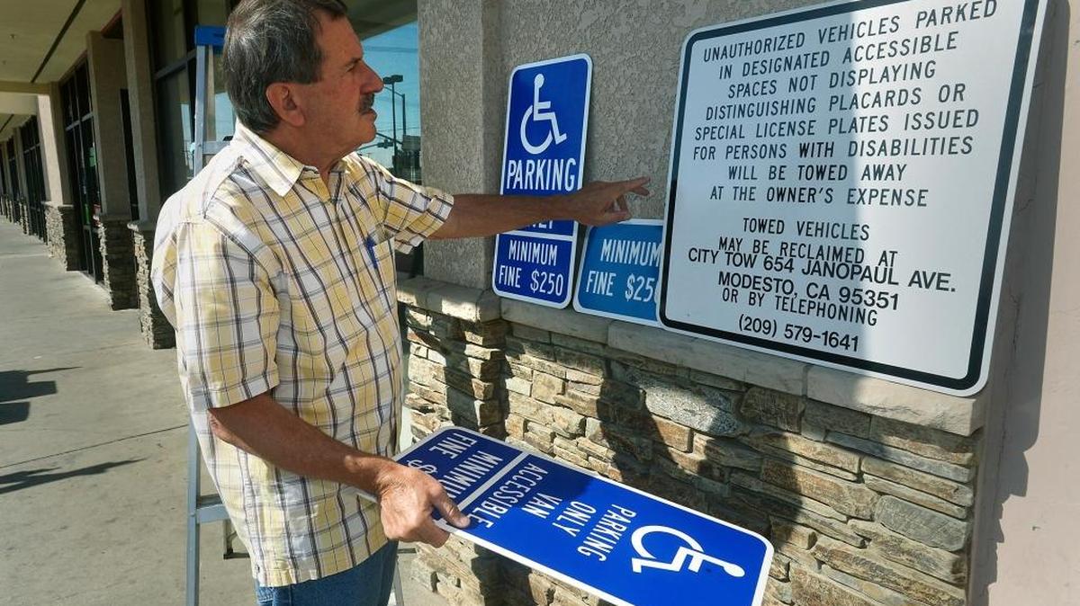 Paul Caruso spent $68,000 modifying his shopping center on Modesto’s Crows Landing Road to accommodate disabled patrons, including installing new signs.