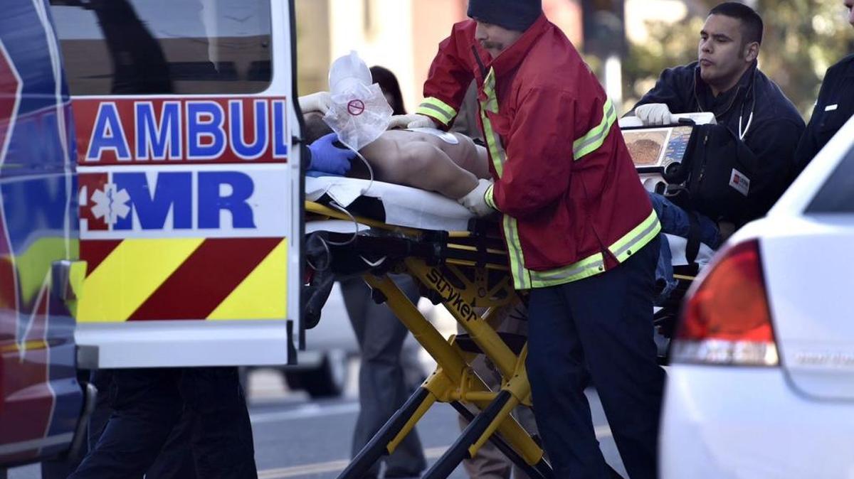 Emergency crews work on Christopher Fletcher in downtown Modesto on Dec. 17 after he was shot by police.