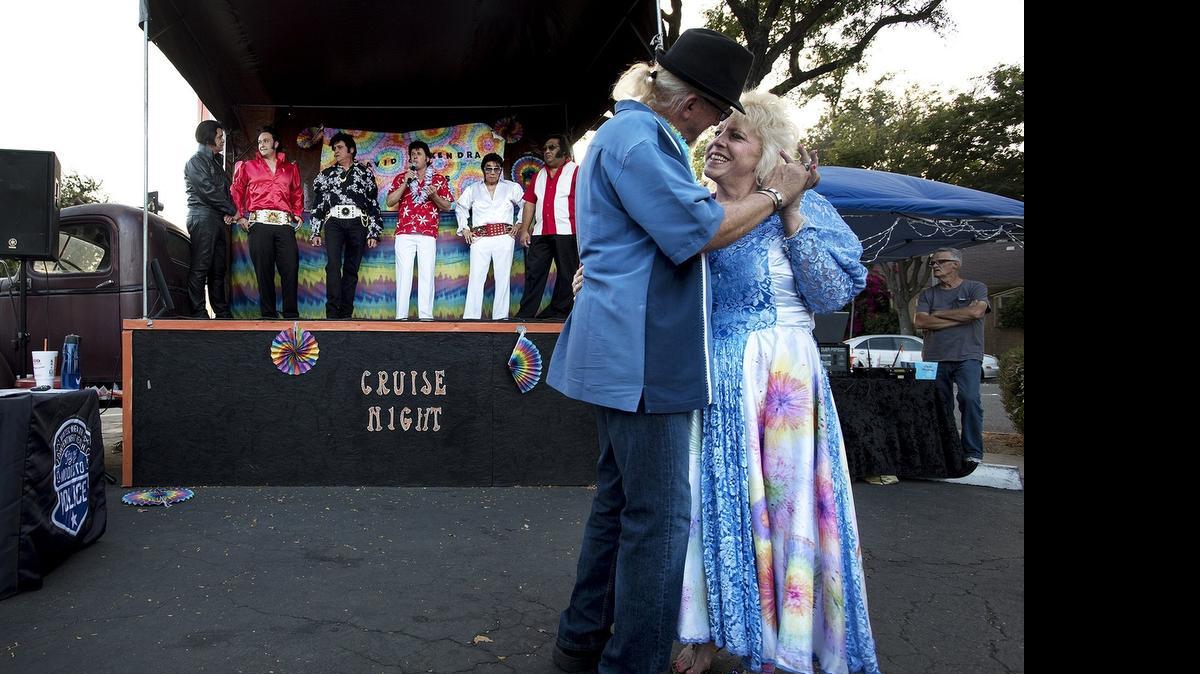 
Kendra and David Walters enjoy their first dance as newlyweds, serenaded by six Elvis impersonators at the A&W restaurant in downtown Modesto on Friday. The Modesto couple met on the online line dating site Plenty of Fish and wanted to get married to the music of Elvis Presley.
