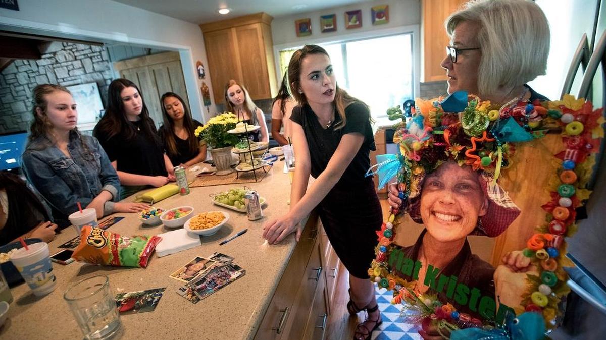Modesto Girl Scout Troop 3380 leader Joanne Serpa, right, holds a large picture of Kristen Machado as she, Claire Machado, middle, and other members of the troop share memories of their former troop leader during a gathering at Serpa’s home in Modesto, Calif., on Tuesday, July 26, 2016. Kristen Machado formed the troop in 2003 and led it for nine years. Seven of those, she also battled sarcoma cancer – a fight she lost Oct. 29, 2012, less than two weeks before her 40th birthday.