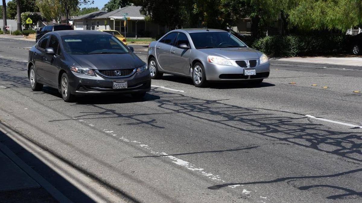 Tully Road near Roseburg Avenue in Modesto, Calif., shows repaired cracks, as seen Friday afternoon, July 22, 2016. If passed in November, proceeds from a road tax would help fix and improve streets throughout Stanislaus County.