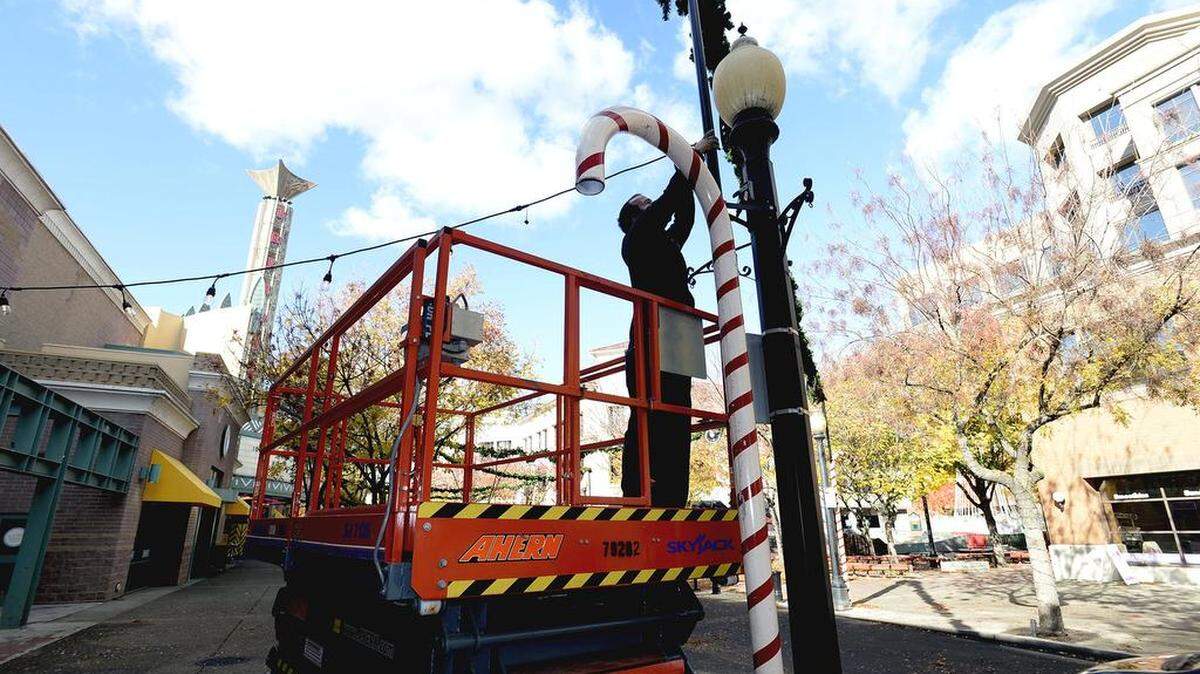 It's beginning to look a lot like Christmas in downtown Modesto as crews worked to prepare 10th Street between J and K Streets on Monday, Nov. 27, 2017, for the upcoming holiday Rockin' Holiday Tree Lighting, among other festivities.