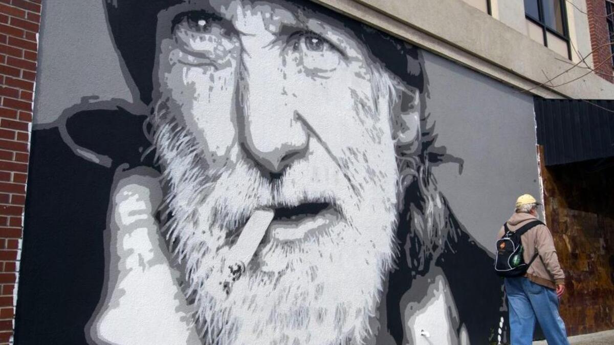 A mural of Rick Hernstedt, a longtime homeless man who died in September, is seen on J Street between 10th and Ninth streets on Friday, Feb. 26, 2016.